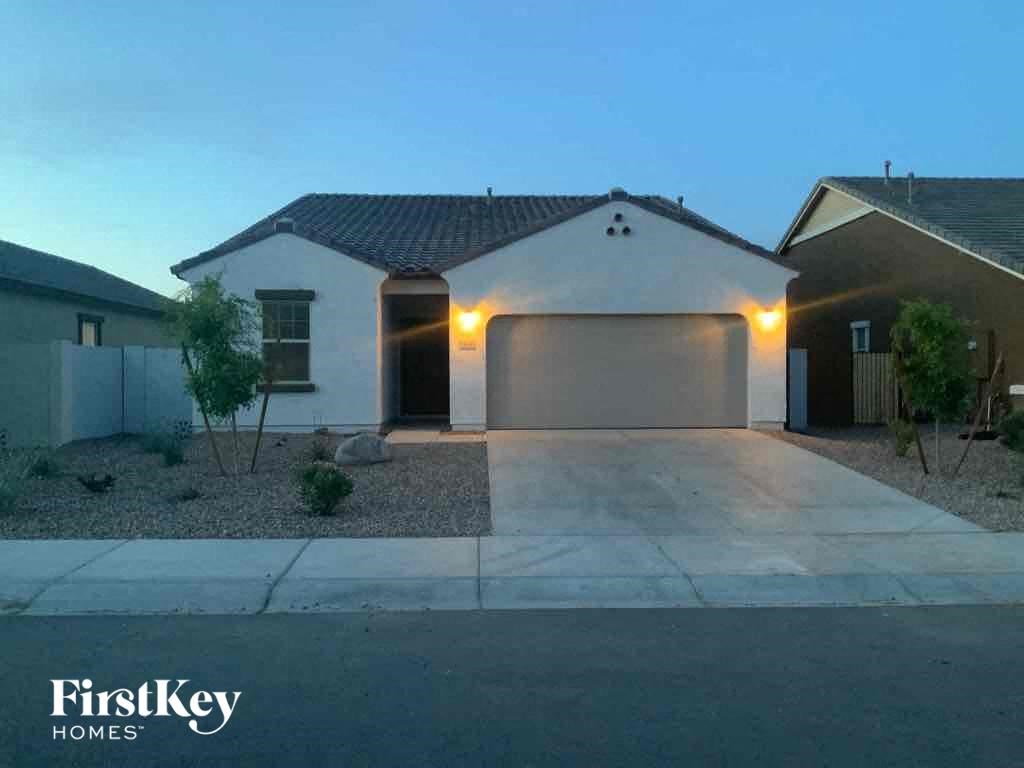 a brand new house with a driveway and a garage door