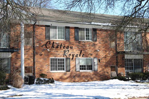 A red brick building with the words "Chateau Royale" painted on the side.