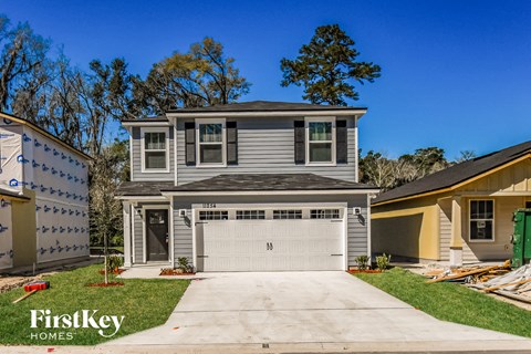 a blue house with a white garage door