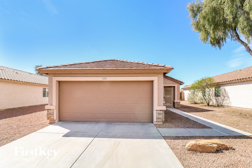 A house with a garage door that says "FirstKey" on it.