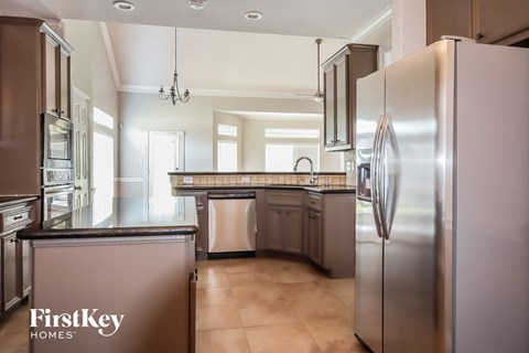 a kitchen with stainless steel appliances and a counter top
