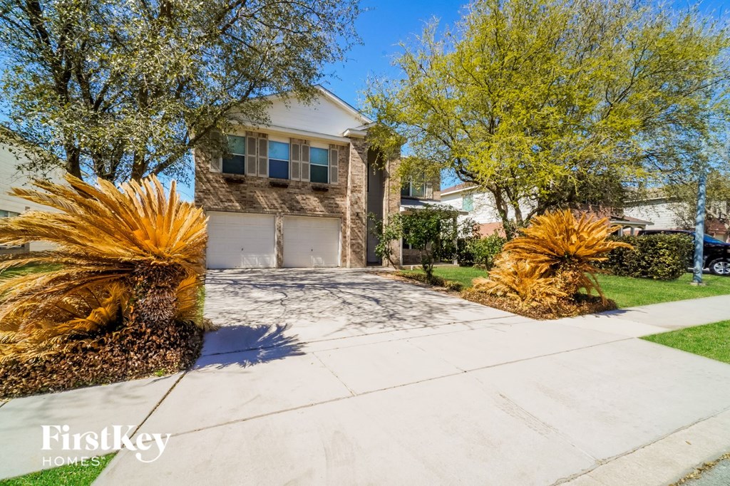 a house with a driveway and a garage door