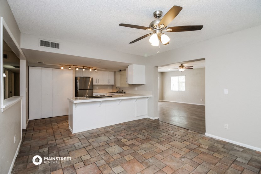 the kitchen is open to the living room and dining room