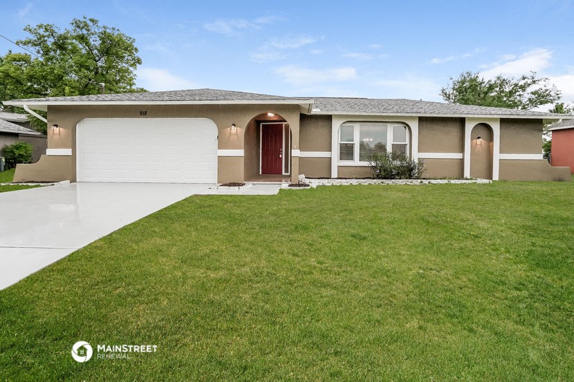 a house with a lawn in front of it