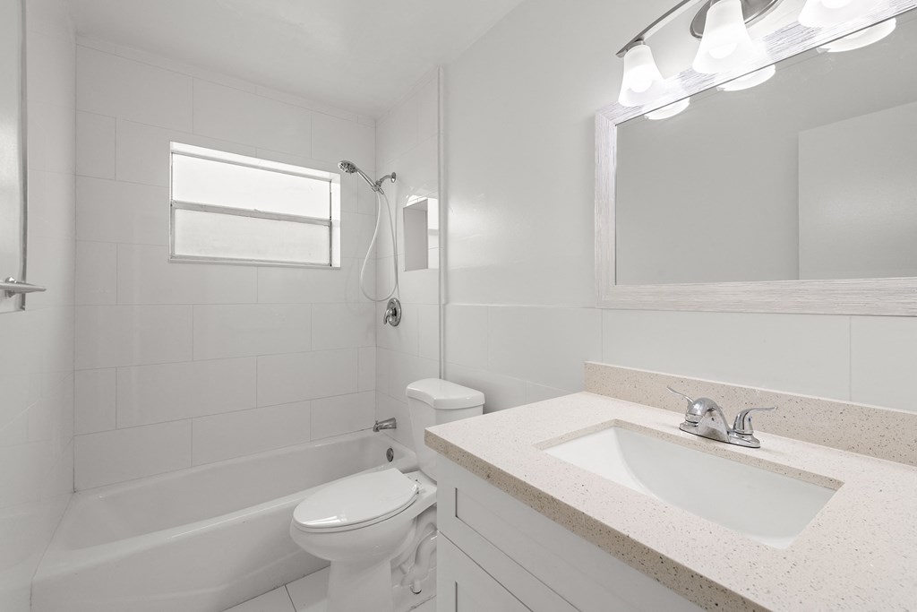an empty bathroom with a sink and a toilet