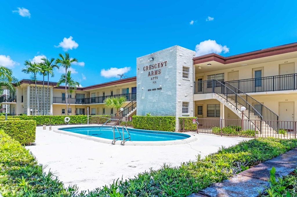 the swimming pool at or near destin inn and suites