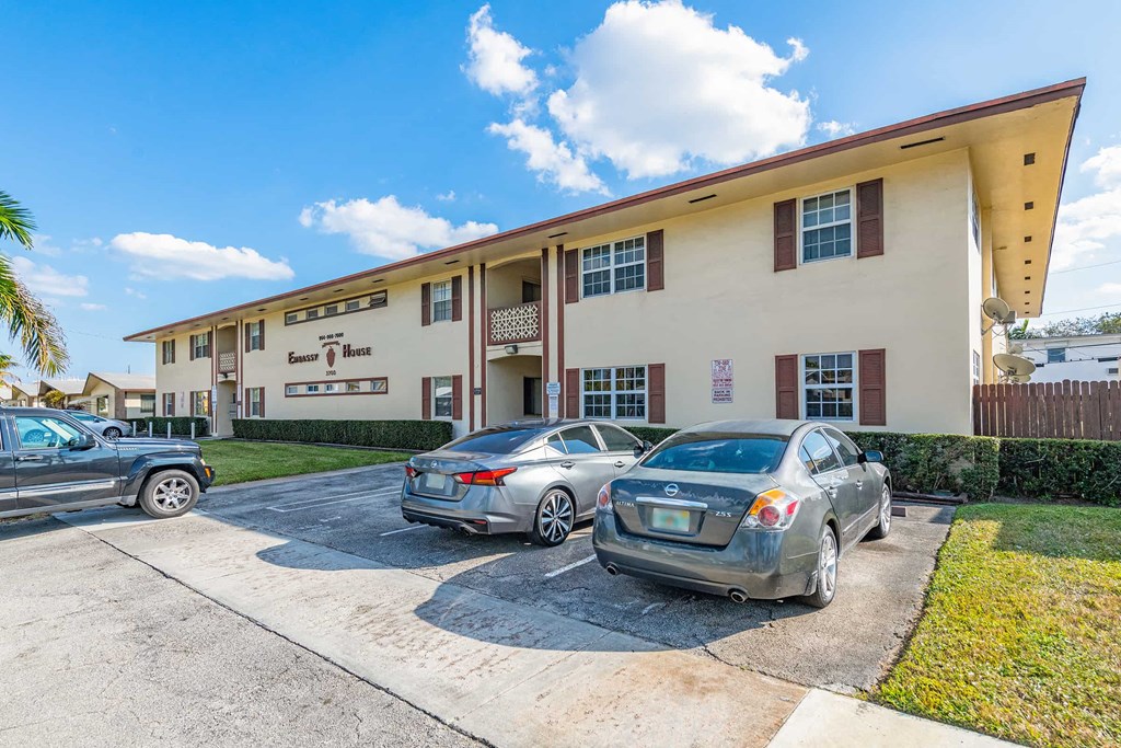 a building with cars parked in front of it