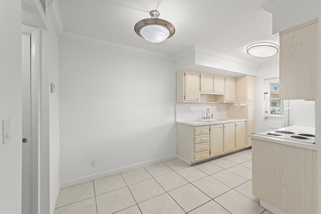a kitchen with a stove and a sink