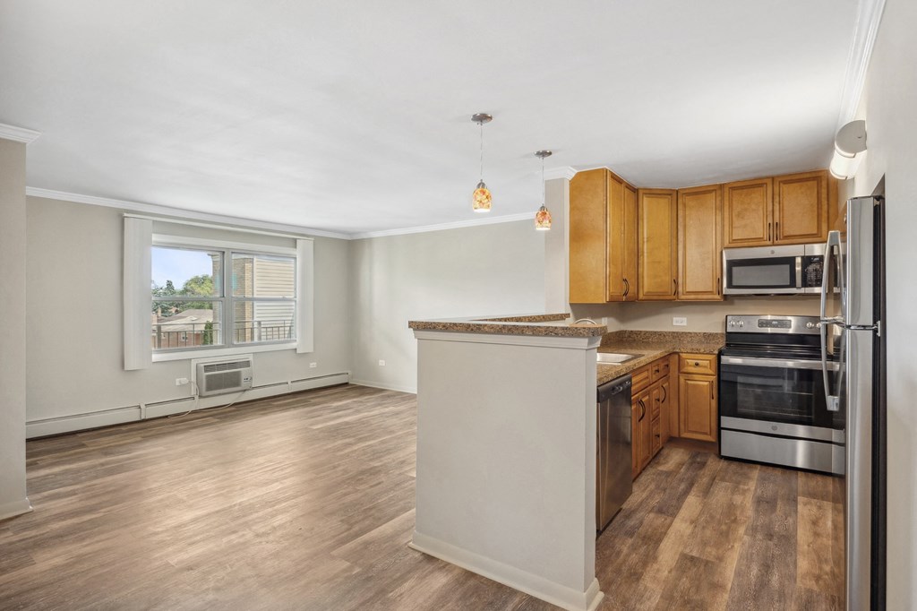 an empty kitchen with an island in the middle