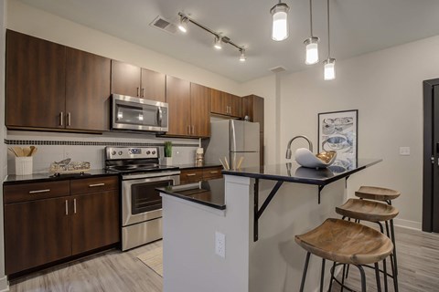 a kitchen with stainless steel appliances and a counter top