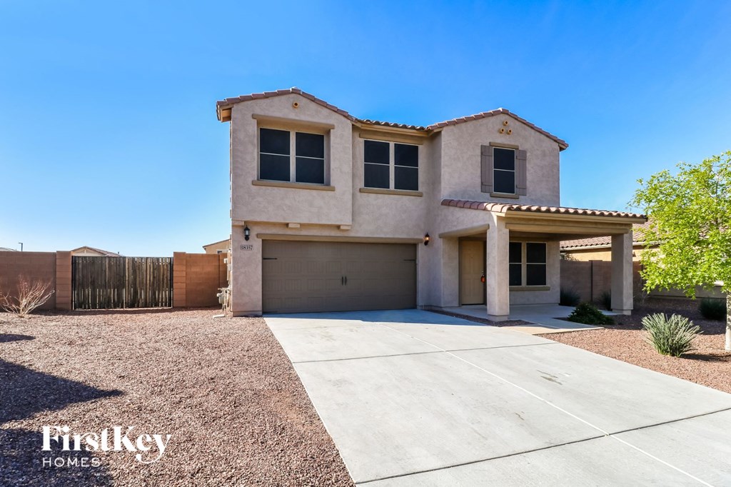 a house with a driveway and a garage door