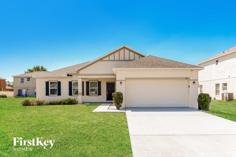 A house with a garage is for sale by FirstKey Homes.