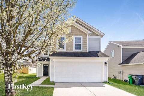 A house with a garage is for sale by FirstKey Homes.