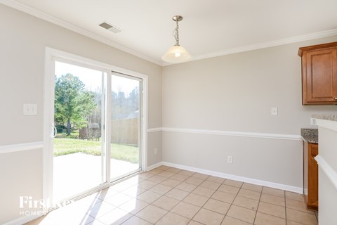 A sunny room with a sliding glass door.