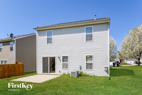 A two-story house with a garage is for sale by FirstKey Homes.