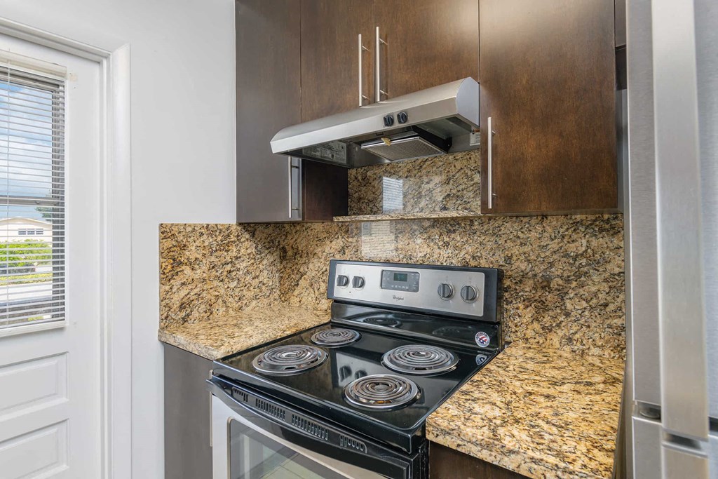 a kitchen with a stove and a counter top