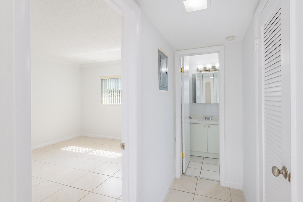 a renovated living room with a bathroom and a closet