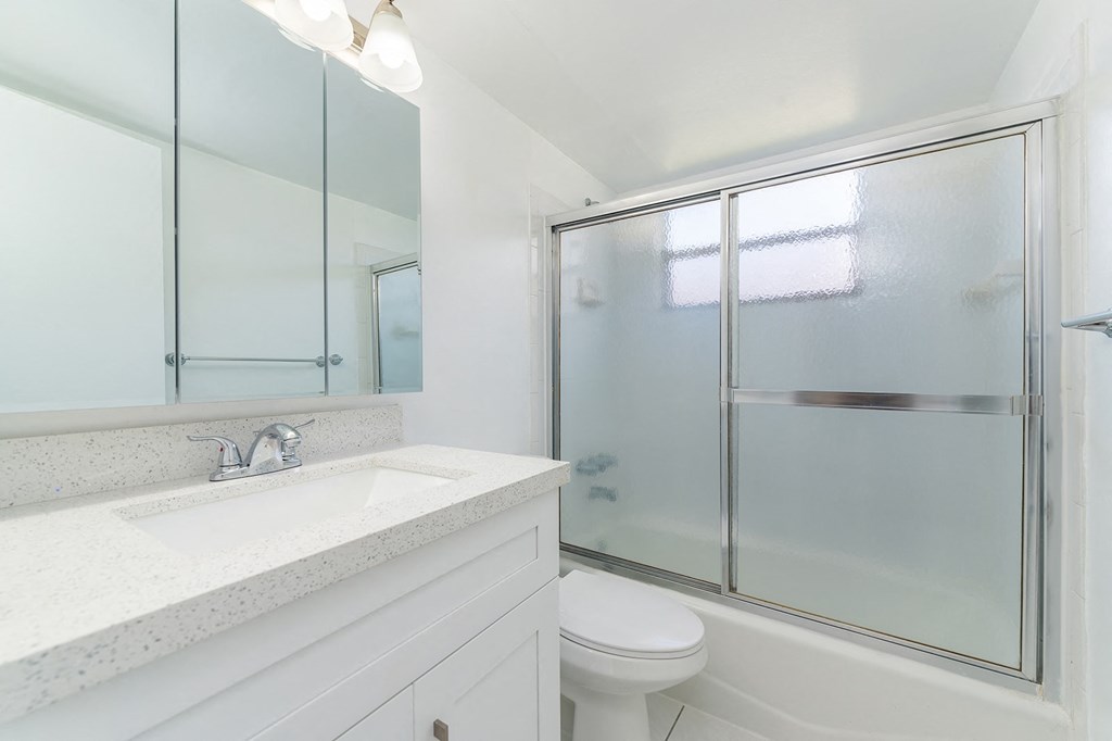 a bathroom with a sink toilet and a shower