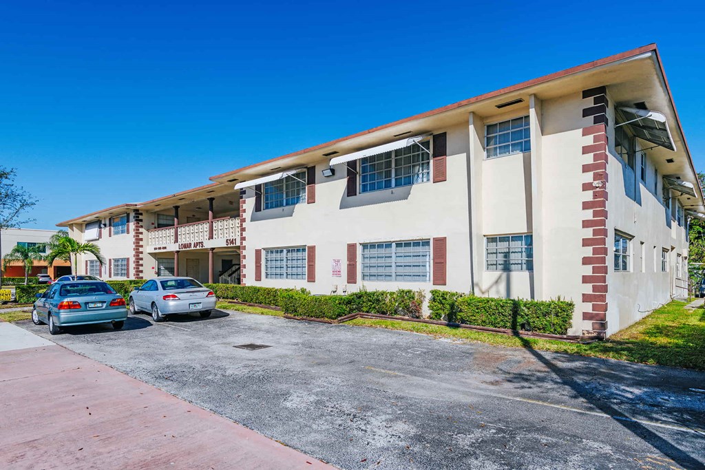 a building with cars parked in front of it