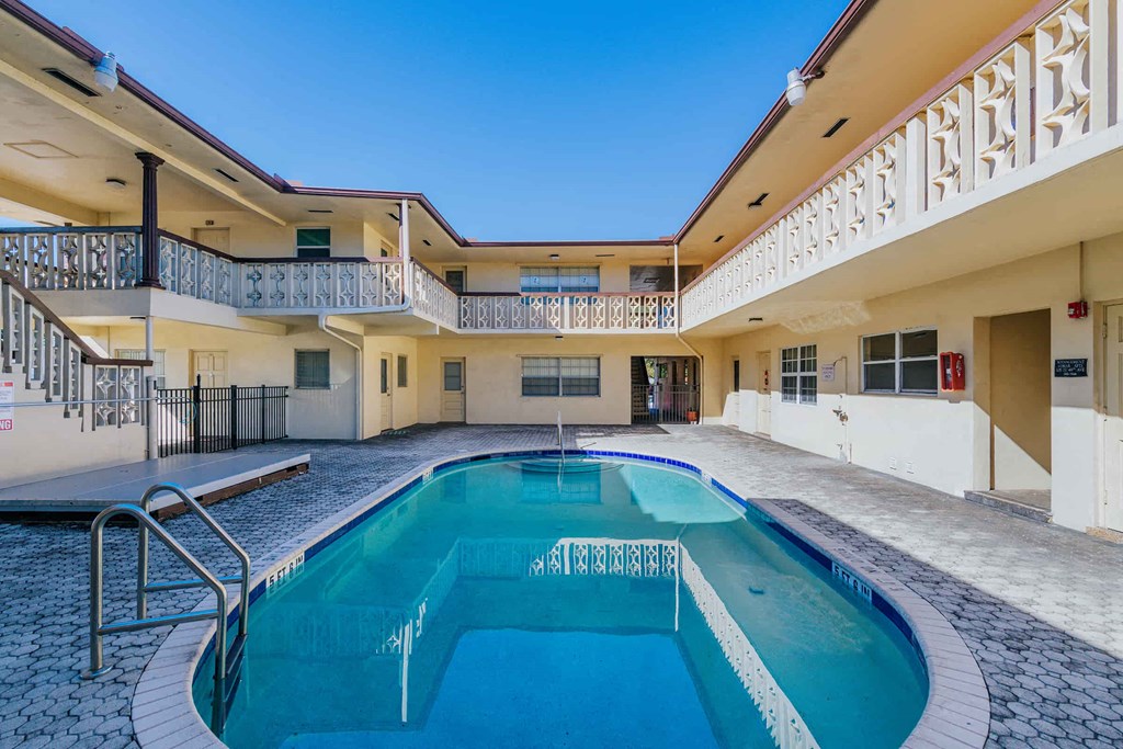 a swimming pool in the center of a building with a pool