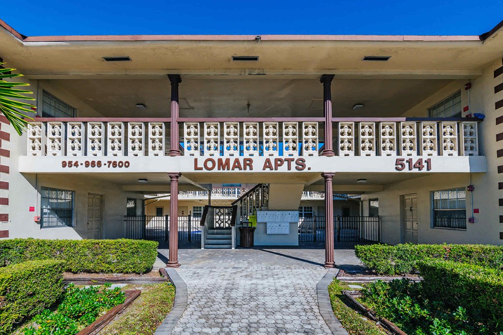 the front of the lomar apartments building