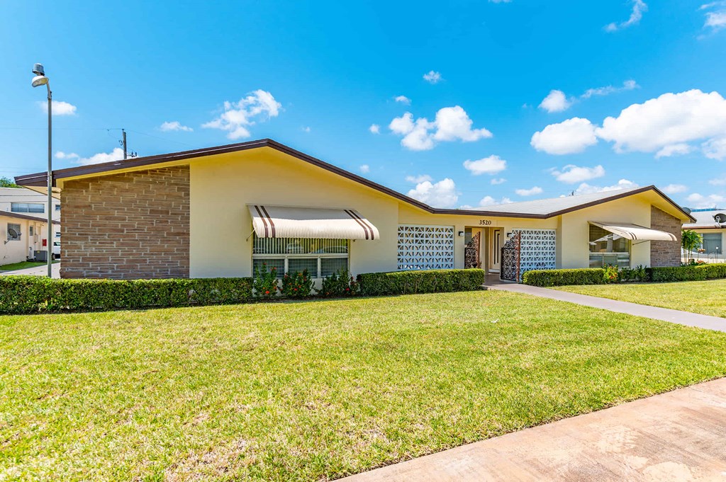 a house with a lawn in front of it