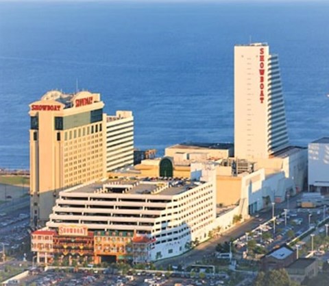 A cityscape with a large building that has the word "Showplace" on it.