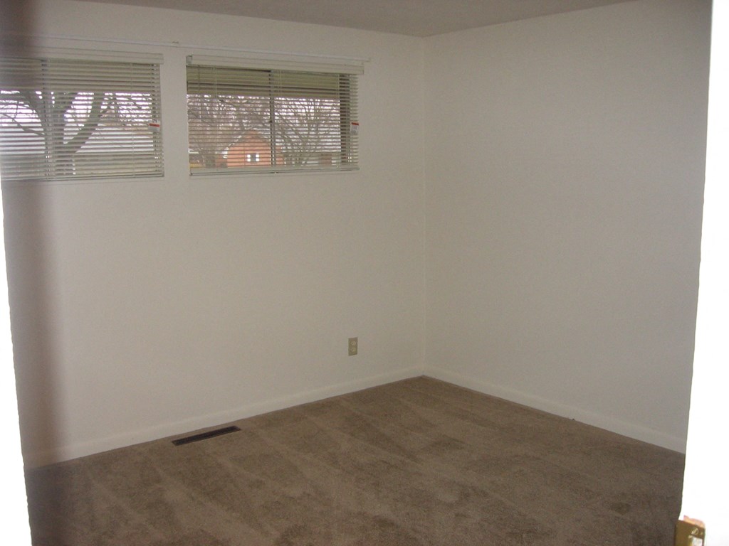an empty room with a window in it
