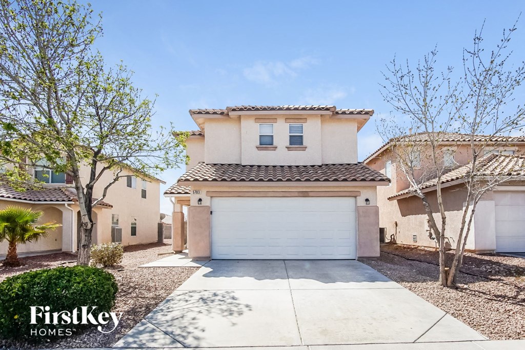 A house with a garage is for sale by FirstKey Homes.