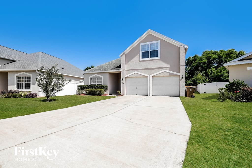 A house with a driveway in front of it.