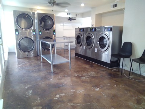 A laundry room with a washer and dryer in it.