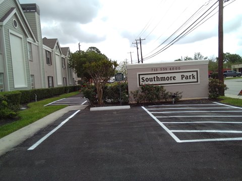 A sign for Southmore Park is in front of a building.