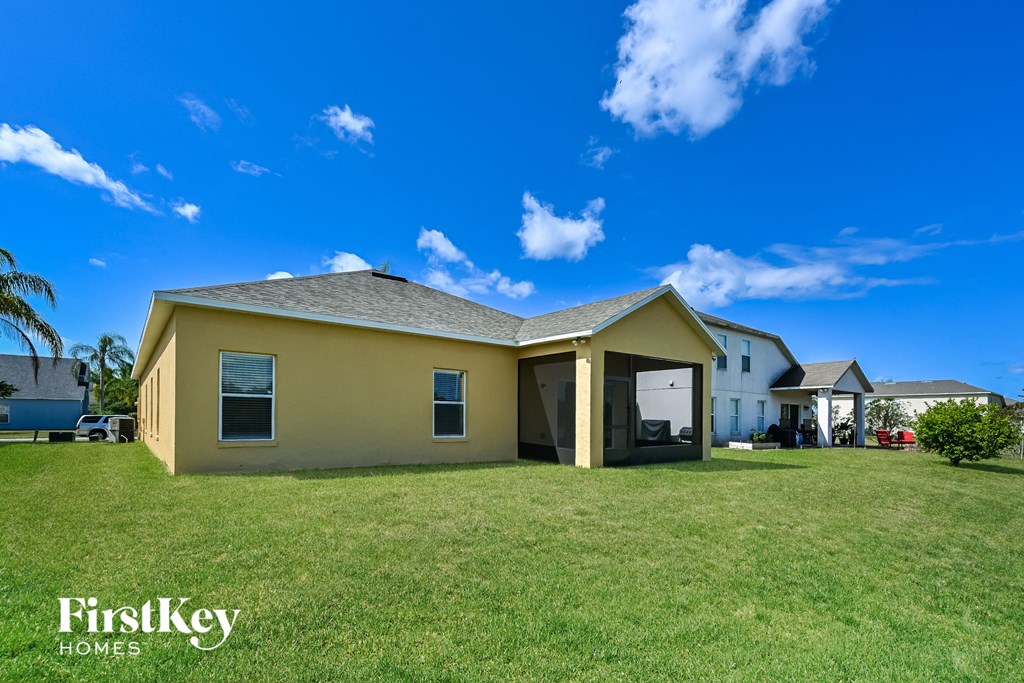 A house with a lawn in front of it and the words "FirstKey Homes" on the bottom left.