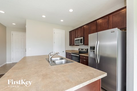 a kitchen with stainless steel appliances and a counter top