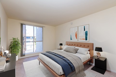 A bedroom with a large bed and a painting on the wall.