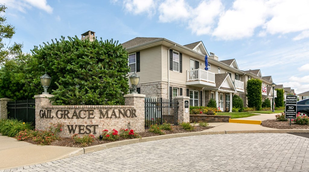 the estates sign in front of a house