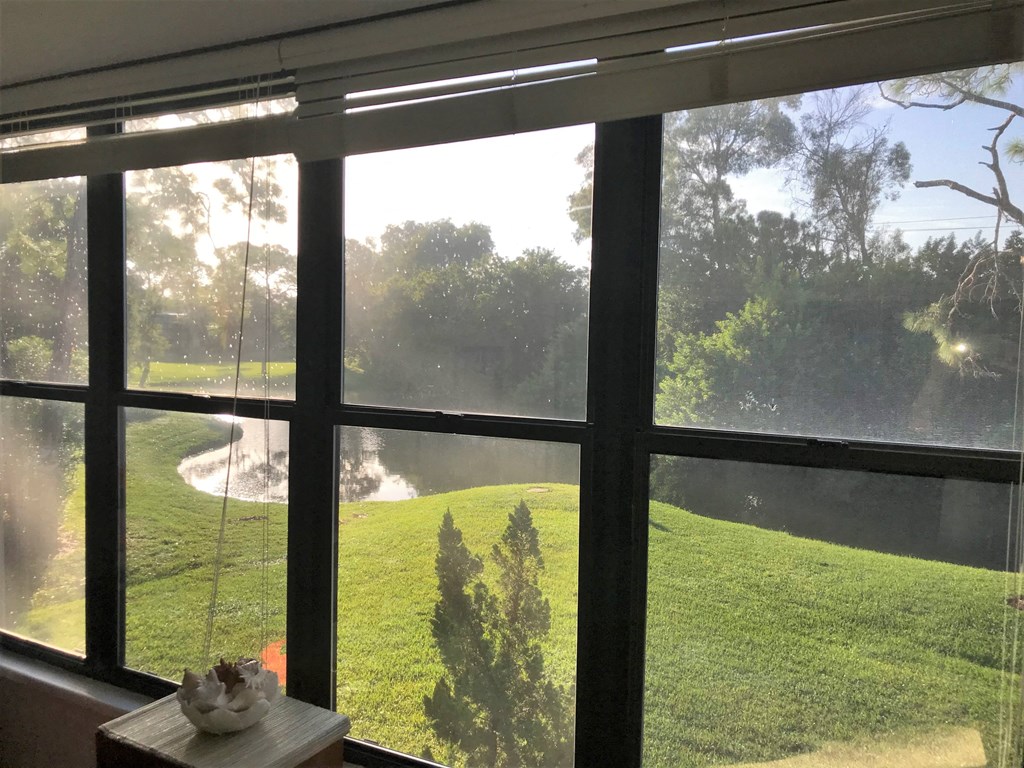 the view from the living room window of the golf course