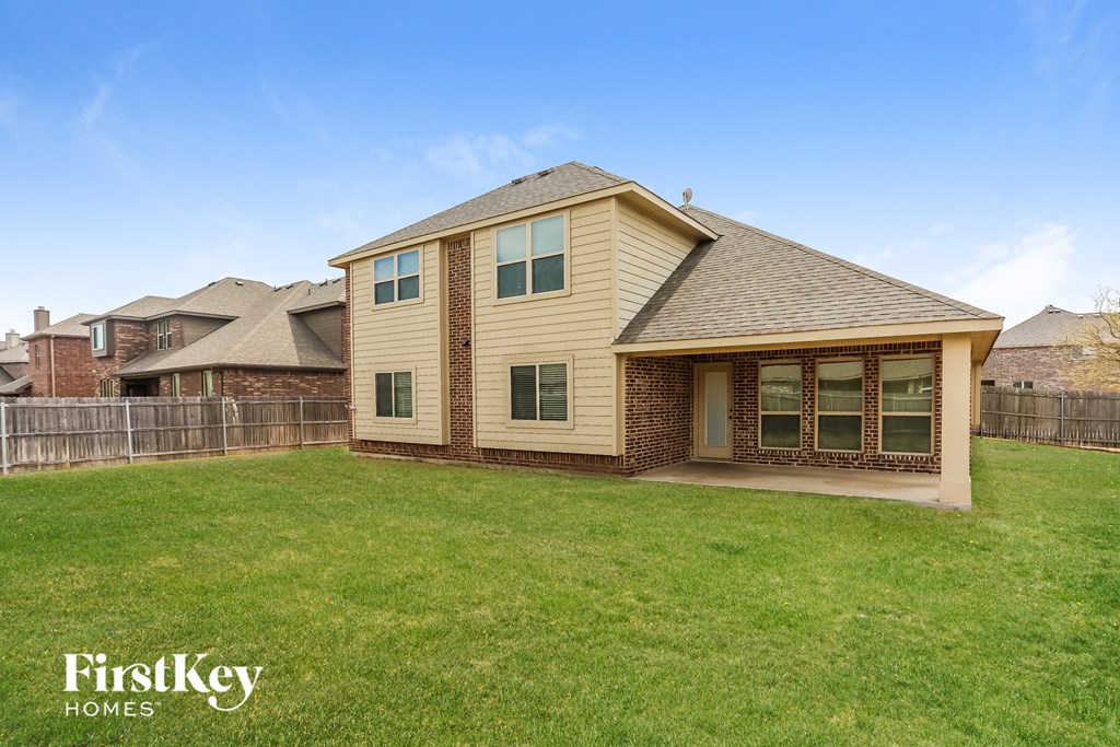 A house with a lawn in front of it.