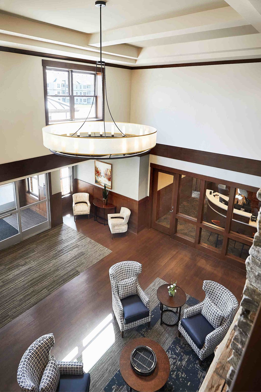 a view of a lobby with chairs and a chandelier