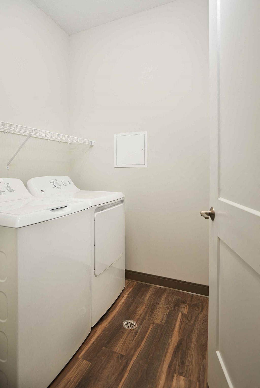 a washer and dryer in a room with a door