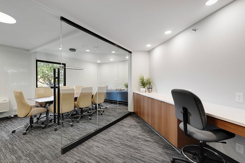 Business center with conference room and individual desks