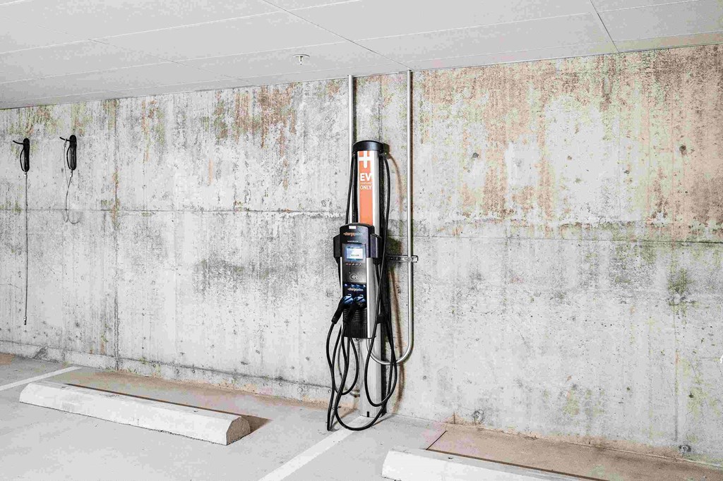 a gas pump is plugged into a wall in a garage