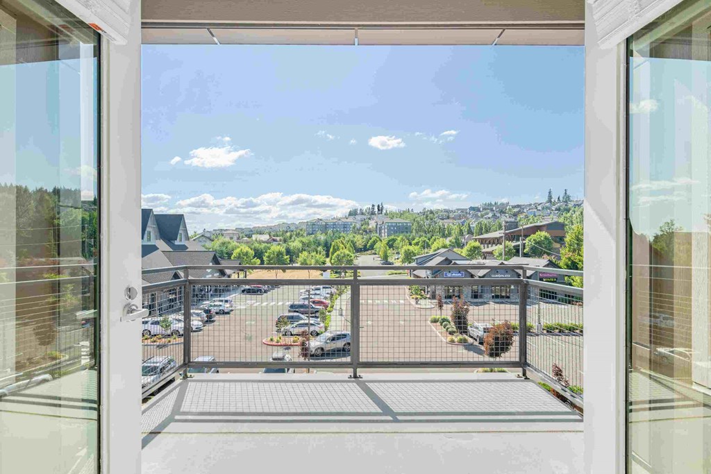 a balcony with a view of the city