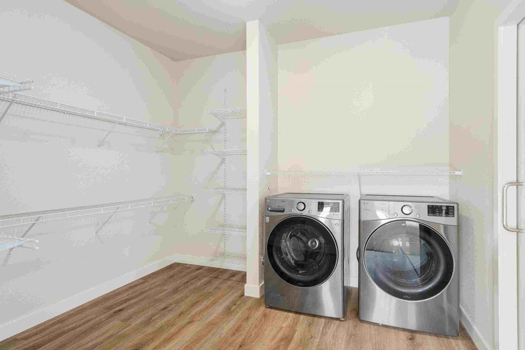 a laundry room with a washing machine and a dryer