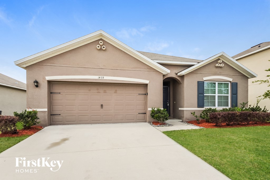 A house with a garage door that says 44118 on it.