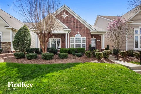 a home with a front yard and green grass