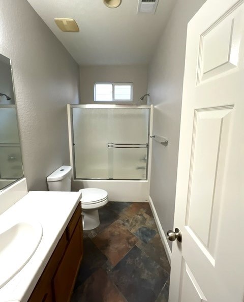 A bathroom with a toilet, sink, and shower.