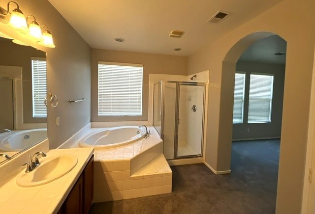 A bathroom with a double sink and a large mirror.