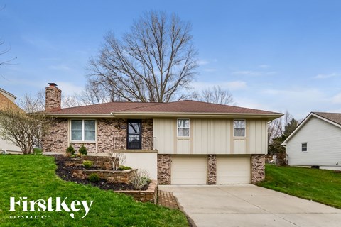 a home with a sidewalk in front of it
