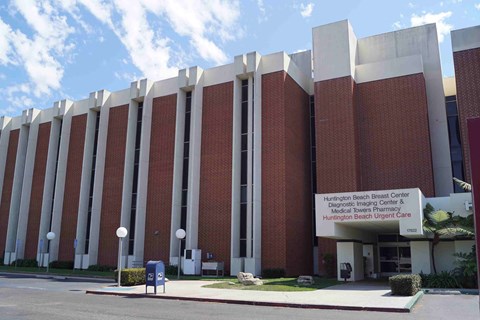 a large brick building with a sign in front of it